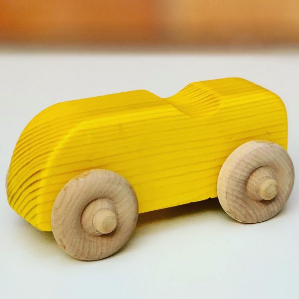 yellow wooden toy car